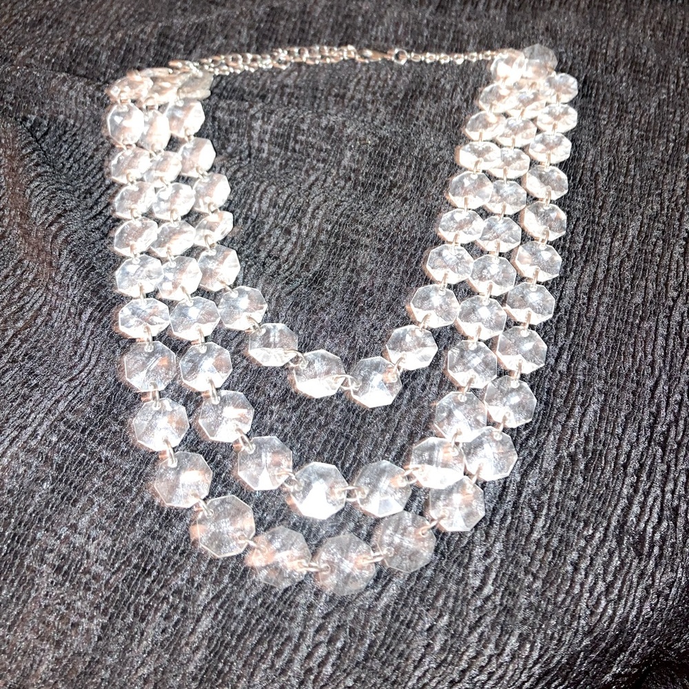 Three strand clear bead necklace.